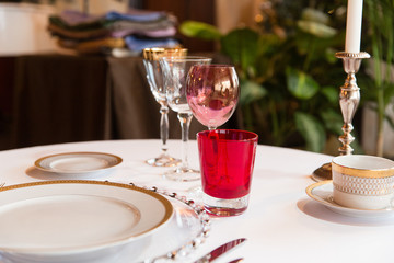 Festive crockery stand on the table ready for a dinner