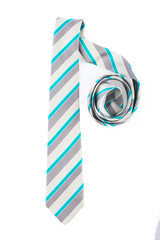 Obraz premium Grey tie with blue stripes. Twisted half. On white, isolated background. Top view. Flat lay.