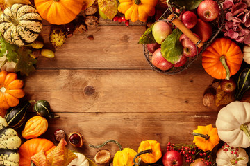 Bunches of squash around blank area on table