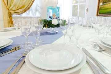 A view from a white plate on crockery which stands on the dinner