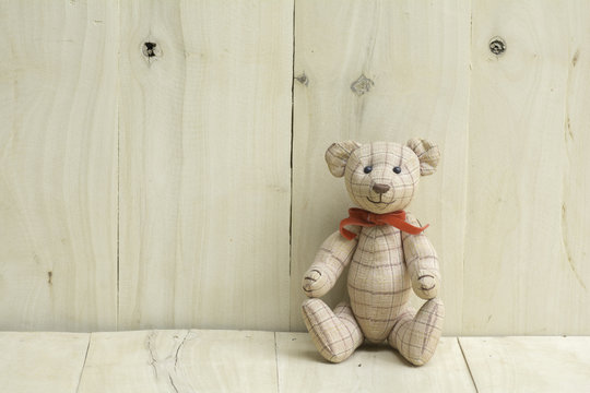 teddy bear on wooden floor