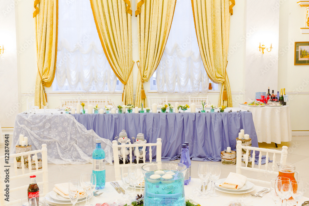 Wall mural Long table in restaurant dressed in violet cloth and surrounded