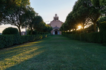 Church's green walk and sun.