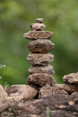 Fototapeta na wymiar Beautiful Stones stacked layers and blurry forest background