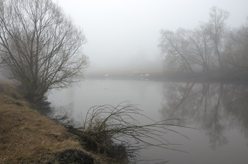 Springtime.Misty spring landscape with river.