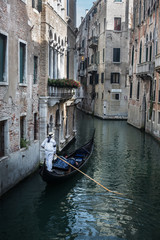 Fototapeta na wymiar Gondola on a Canal in Venice