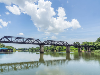 Railway trains track on metal bridge with the river and sky