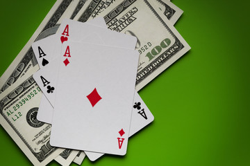Playing cards and dollar bills