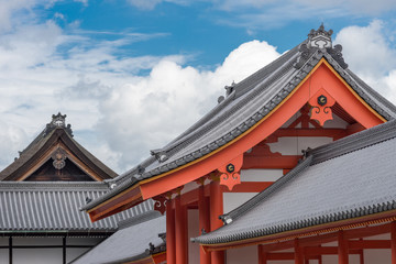 Kyoto, Japan - September 14, 2016: Combination of several roofs at the Imperial Palace. Set against partly blue skies and big white clouds.