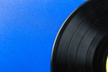 Retro vinyl record on blue background