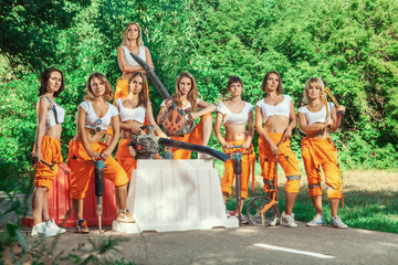 Women workers brigade on the road works background.