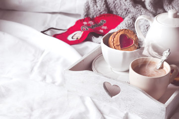 Fototapeta na wymiar breakfast in bed with coffee and cookies