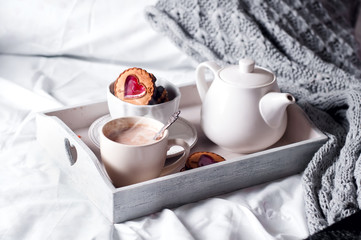breakfast in bed with coffee and cookies