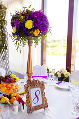 Floral arrangement and gold frame with a number of the decorated