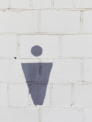 male symbol on a white wall