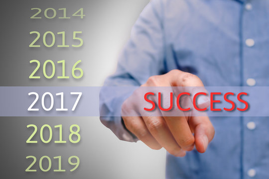 Bussinessman Hand Pointing Success Text For 2017. Targets Concep