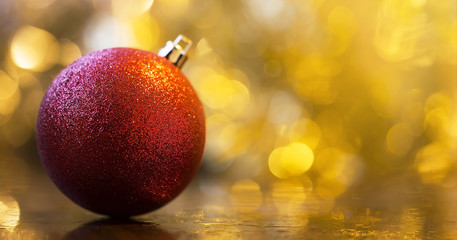 Website banner of a glittering red Christmas ball