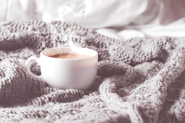 Fototapeta na wymiar Having a cup of coffee in bed