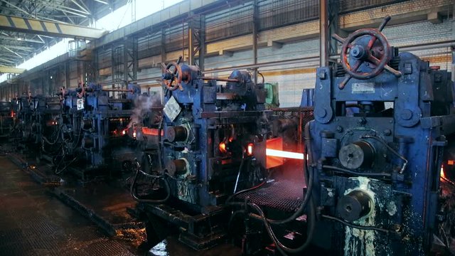 Ironworks plant. Burning Hot Billet moving through Machines