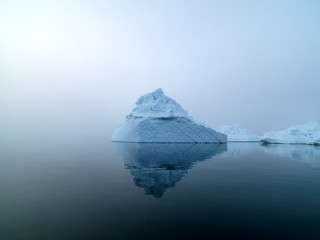 huge icebergs are on the arctic ocean in Greenland