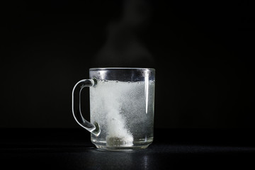 Effervescent tablet in cup of hot water