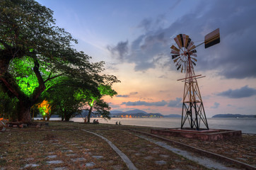 old windmill on sunset