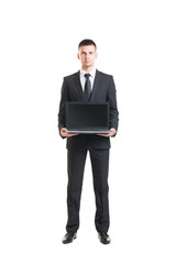 Young and confident business man holding a laptop