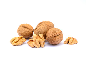 Pile of walnuts in shell isolated with white background