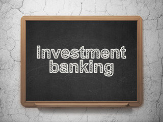 Money concept: Investment Banking on chalkboard background