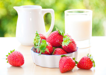 Strawberries in a bowl with cream