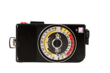 Vintage light meter over white