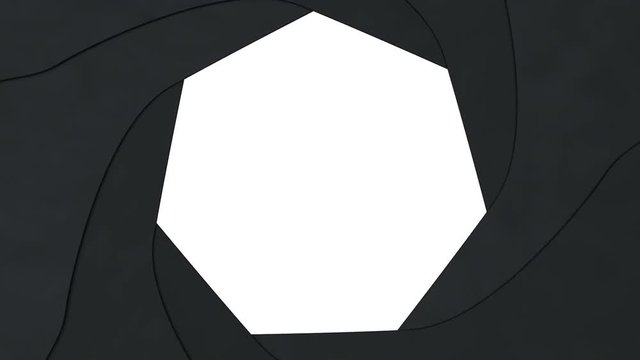 Heptagonal aperture fully closes. Animation of video transition showing closing aperture blades.