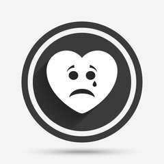 Obraz premium Sad heart face with tear icon. Crying symbol.