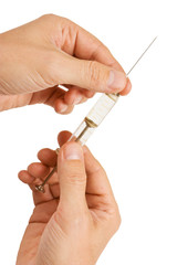 old glass syringe in hand