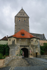 Fototapeta na wymiar Gate tower in Dinkelsbuhl, Germany. It is one of the best-preserved medieval towns in Europe, part of the famous Romantic Road tourist route.
