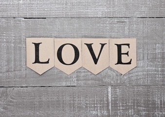 Love letter symbol on wooden board feelings card