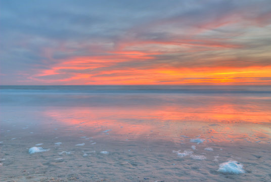 Sunset on a beach at the North Sea. The photo was taken in Noordwijk, the Netherlands