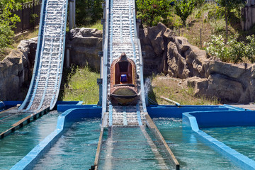 Water game in a hollowed trunk at an amusement park