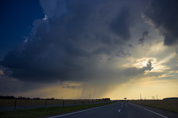 Storm clouds over the road.