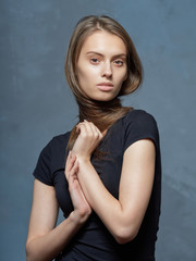 Portrait of a beautiful young girl with a delicate healthy skin.