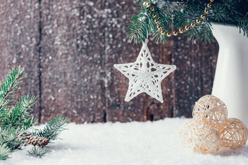 Composition with Christmas decorations in vase on dark wooden background