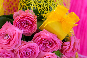 Wedding bouquet of beautiful pink roses with yellow  gift box for jewelry