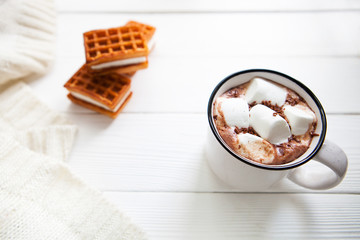 Cup hot chocolate with marshmallows in a ceramic cup, plaid and