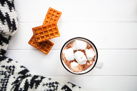 Cup hot chocolate with marshmallows in a ceramic cup, plaid and