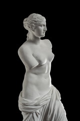 a statue of Venus, plaster column on a black background