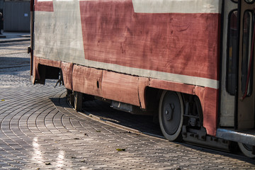 Naklejka premium Old soviet union tram rides on rails in the city