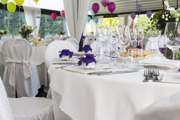 Restaurant with tables set for a wedding reception