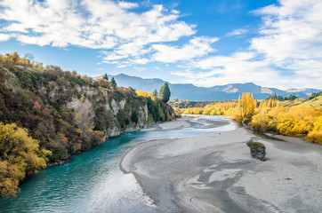 Beautiful view from the Historic Bridge over Shotover River in Arrowtown, New Zealand. - obrazy, fototapety, plakaty