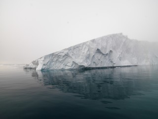 Big icebergs are ont he arctic ocean in Greenland