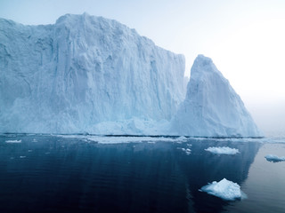 Big icebergs are ont he arctic ocean in Greenland